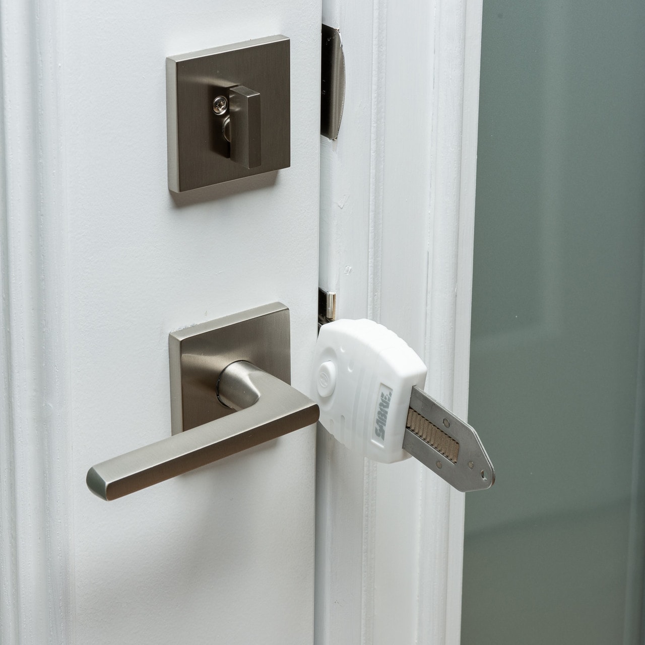 Blocco universale per porte Sabre - White